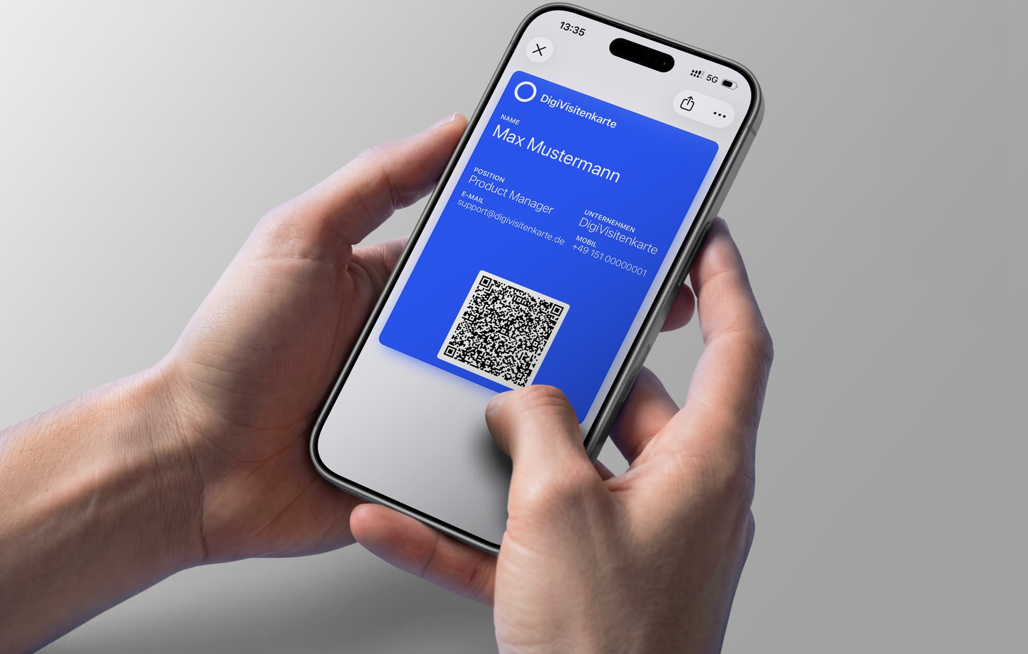 iPhone showing a digital business card with a QR code in Apple Wallet